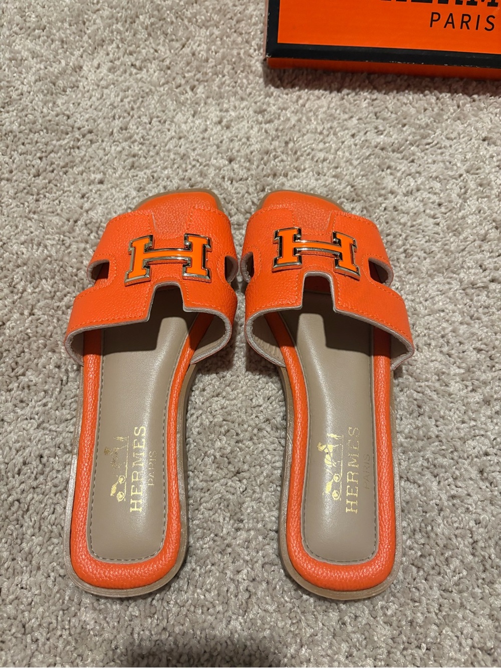 Hermes Orange Oran Slide Mules with Gold H Hardware